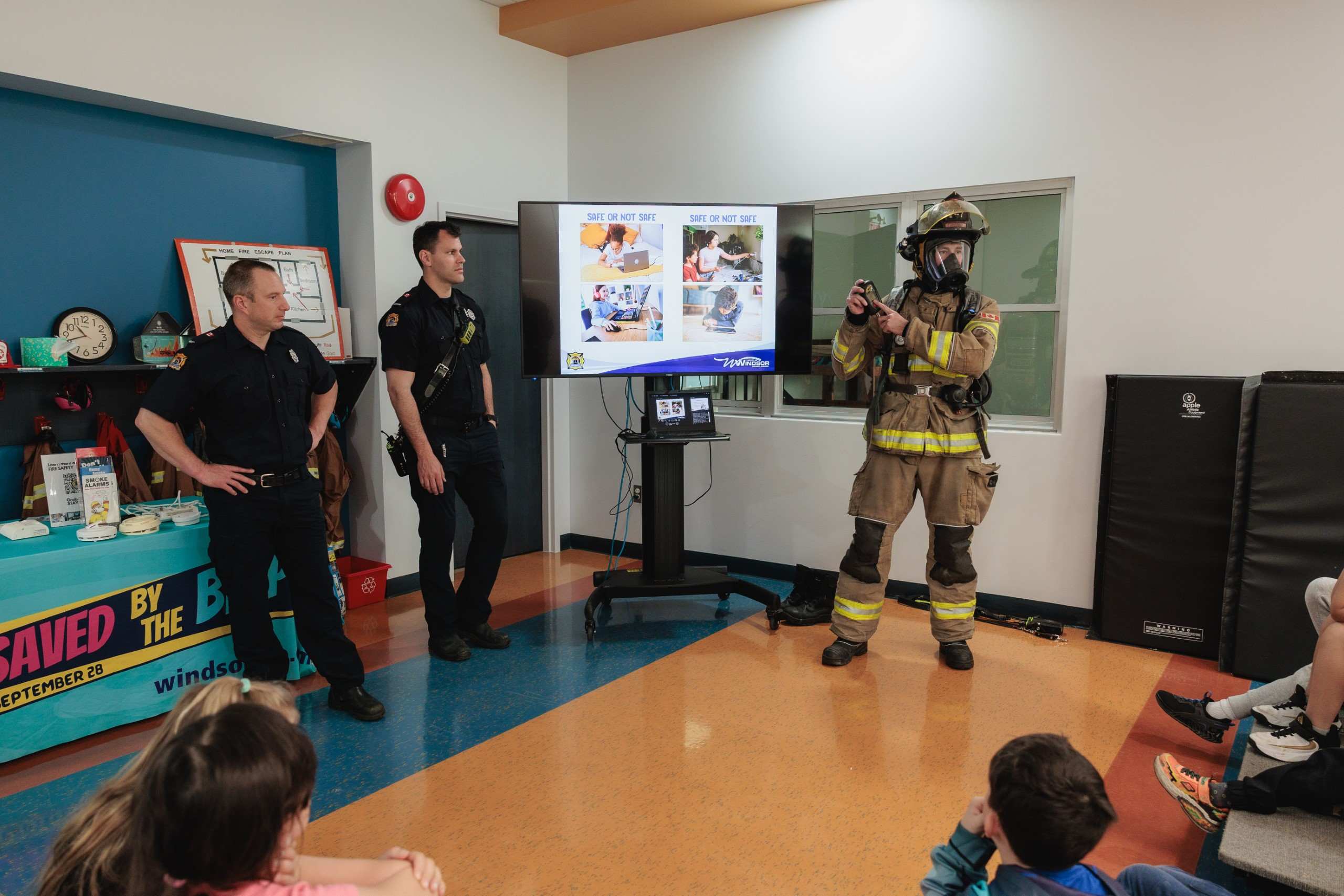 Fire-fighter educators giving gear demonstration